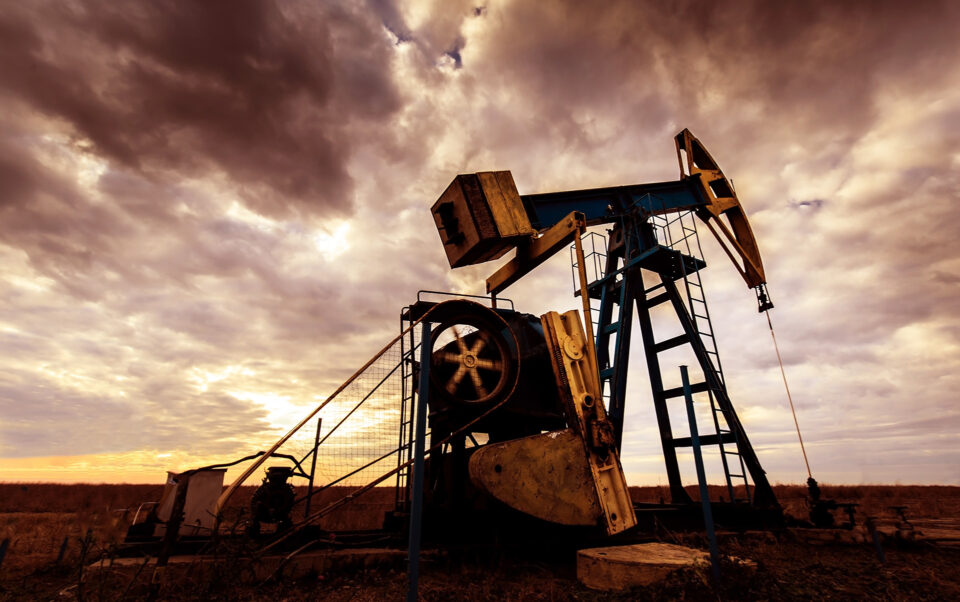 oil well against cloudy sky